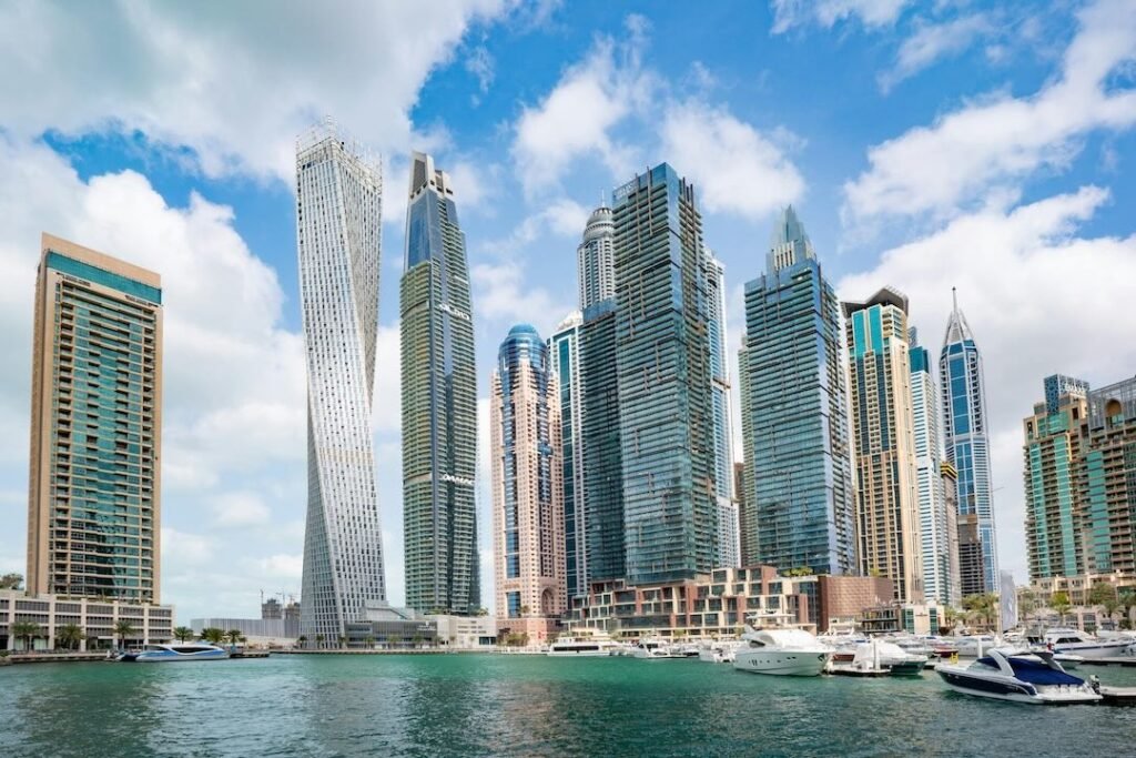 Dubai Marina waterfront skyline with yachts and modern towers – luxury real estate destination highlighted by Tohid Fetrat