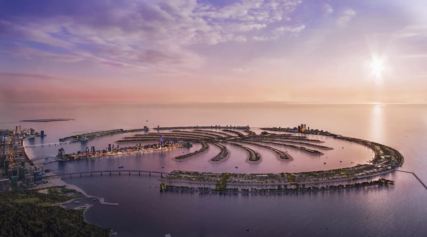 Aerial view of Palm Jebel Ali masterplan by Nakheel showing the iconic palm-shaped island and Dubai’s waterfront skyline at sunset