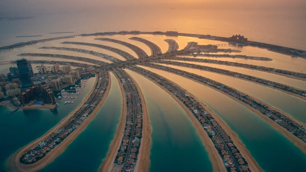 Aerial view of Palm Jumeirah in Dubai, iconic waterfront development by Nakheel at sunset