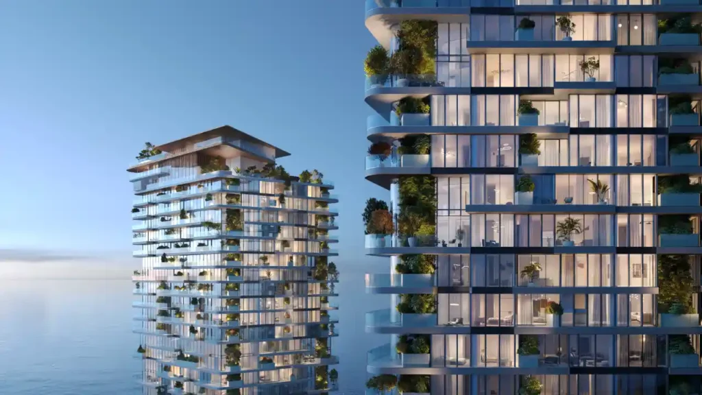 Soulever by Beyond – waterfront twin towers in Dubai Maritime City with glass façades and lush terraces, reflecting the elegance of modern luxury living, presented by Tohid Fetrat.