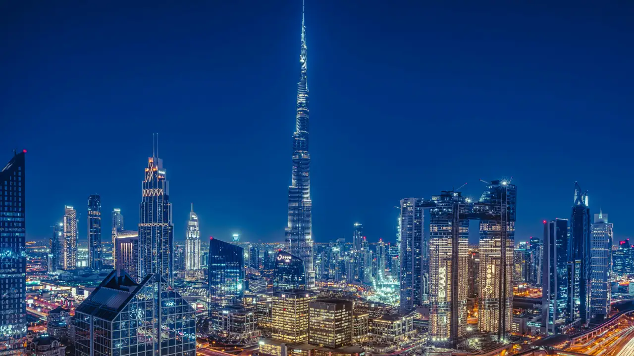 Burj Khalifa and Downtown Dubai skyline illuminated at night — luxury cityscape showcasing Emaar’s architectural icons — presented by Tohid Fetrat.