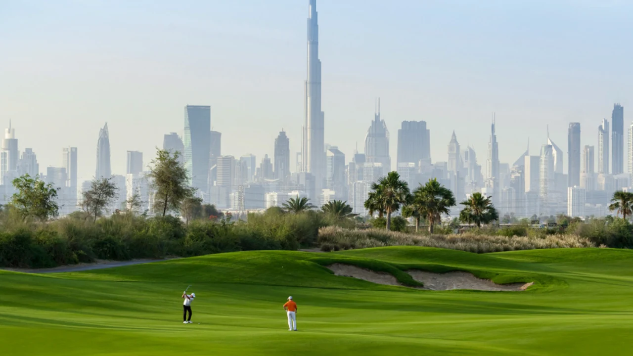 Dubai Hills Estate golf course with Burj Khalifa skyline view — Emaar’s master-planned green community — presented by Tohid Fetrat.