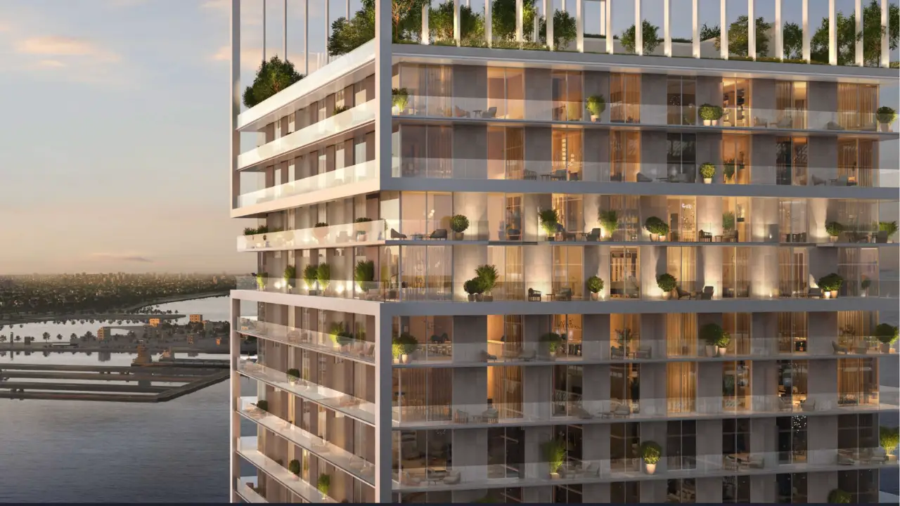 Saria by Beyond in Dubai – modern glass tower with luxury residences and panoramic Palm Jumeirah views, illuminated interiors, and rooftop gardens, presented by Tohid Fetrat.