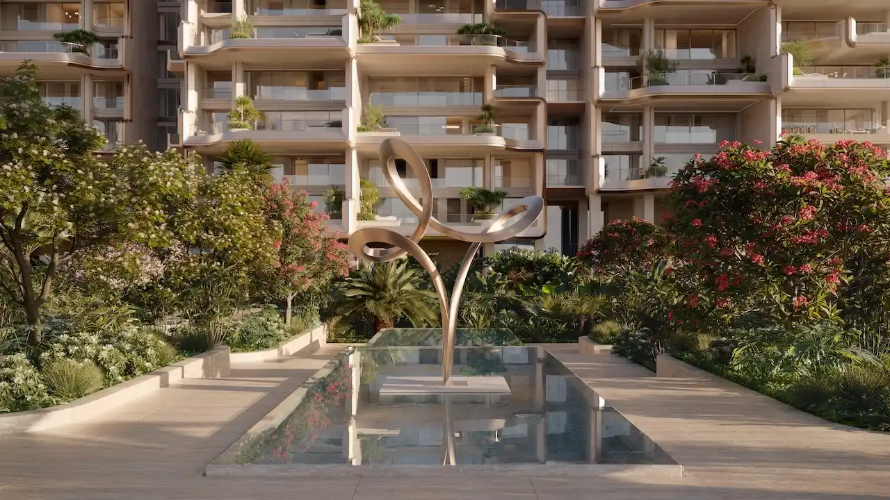 Signature water feature and sculptural garden at Alba Residences by Dorchester Collection and OMNIYAT on Palm Jumeirah, surrounded by lush landscaping and luxury residential architecture. Presented by Tohid Fetrat.