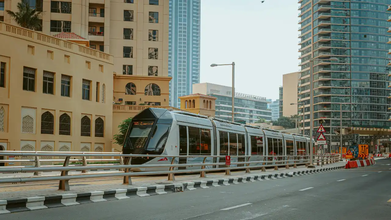 Dubai Tram passing through a modern high rise urban corridor in Dubai - Presented by Tohid Fetrat