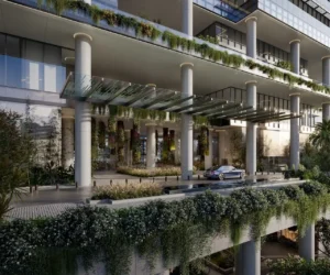 Main drop-off and arrival canopy of ENARA by OMNIYAT in Marasi Bay, Business Bay, featuring a landscaped commercial entrance with vertical greenery and contemporary office architecture. Presented by Tohid Fetrat.