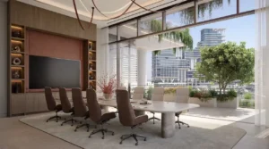 Members club boardroom interior at ENARA by OMNIYAT featuring a refined meeting table, executive seating, integrated shelving, floor to ceiling glazing, landscaped terrace, and Business Bay skyline views in Dubai. Presented by Tohid Fetrat.