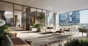 Members club terrace at ENARA by OMNIYAT in Marasi Bay, Business Bay, featuring an open-air lounge with marina views, contemporary seating, and a refined waterfront business atmosphere. Presented by Tohid Fetrat.