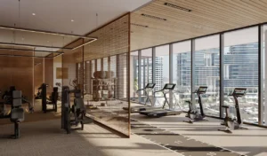 Members club wellness centre gym interior at ENARA by OMNIYAT featuring modern fitness equipment, cardio and strength training zones, floor to ceiling windows, and panoramic Business Bay city views in Dubai. Presented by Tohid Fetrat.