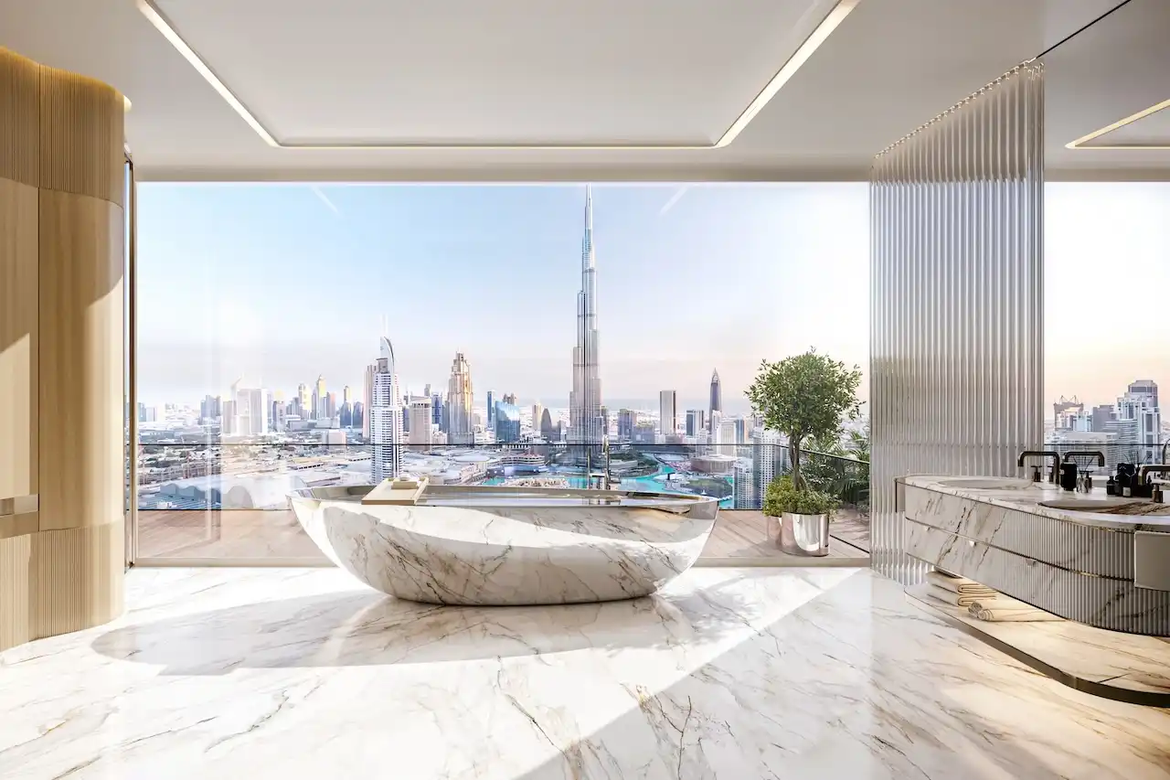 Ultra luxury bathroom interior at Bugatti Residences by Binghatti in Business Bay Dubai, featuring marble finishes, freestanding bathtub, and panoramic Burj Khalifa skyline view. Presented by Tohid Fetrat.