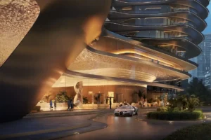 Luxury arrival view of Bugatti Residences by Binghatti in Business Bay Dubai, featuring sculptural architecture, illuminated curves, and exclusive supercar entrance experience. Presented by Tohid Fetrat.
