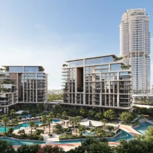 City Walk Crestlane by Meraas showing elevated luxury residences with glass facades landscaped lagoon style pools shaded lounging areas and lush community greenery presented by Tohid Fetrat.