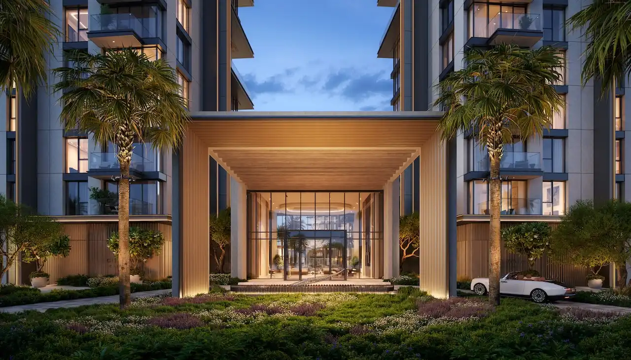 City Walk Crestlane by Meraas showing a grand entrance with illuminated architectural columns glass lobby facade landscaped greenery and a luxury arrival experience presented by Tohid Fetrat.