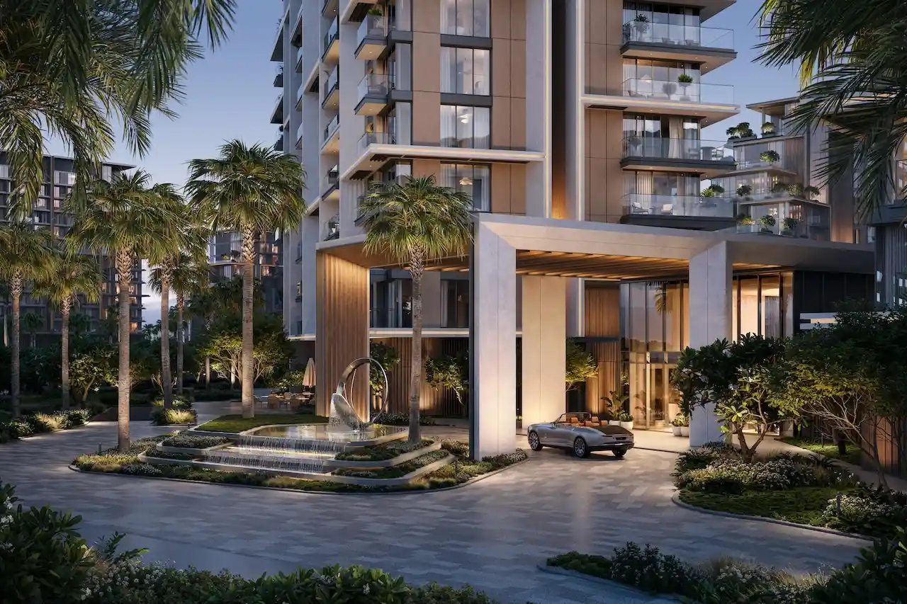 City Walk Crestlane by Meraas showing a luxury illuminated entrance with modern columns cascading fountain landscaped greenery and an elegant arrival experience presented by Tohid Fetrat.
