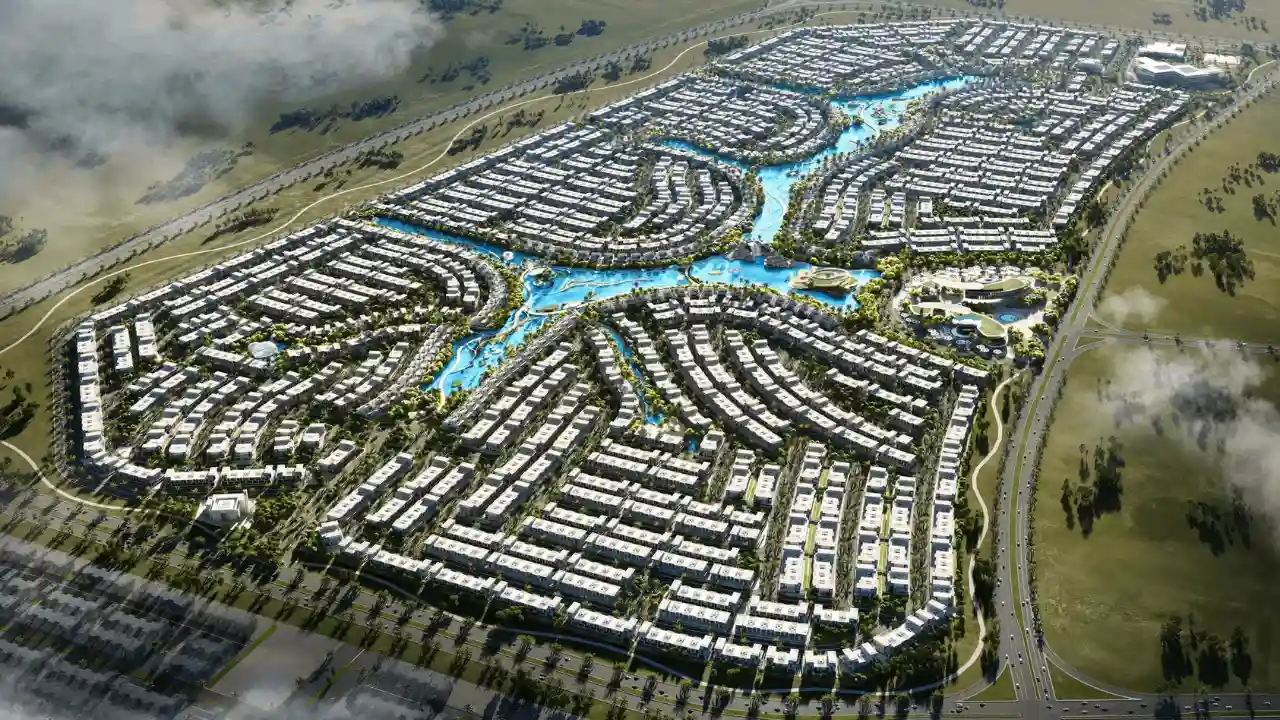 Aerial masterplan view of DAMAC Islands 2 featuring crystal lagoons, low density island clusters, and resort style residential layout in Dubailand, presented by Tohid Fetrat.