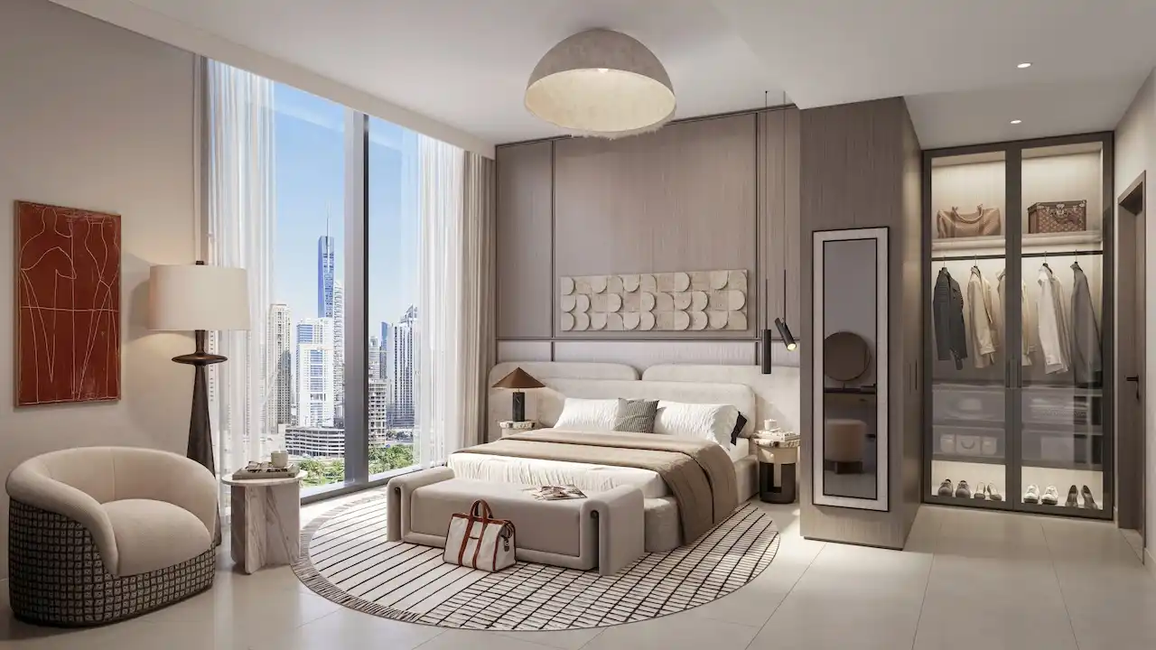 Luxury bedroom wardrobes at Eltiera Views featuring built-in storage, elegant finishes, and a modern open-closet design, offering a refined residential lifestyle in Dubai. Presented by Tohid Fetrat.