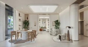 Luxury co-working space at Eltiera Views featuring a marble communal table, modern seating, soft lighting, and elegant interior design, offering a refined work and social environment in Dubai. Presented by Tohid Fetrat.