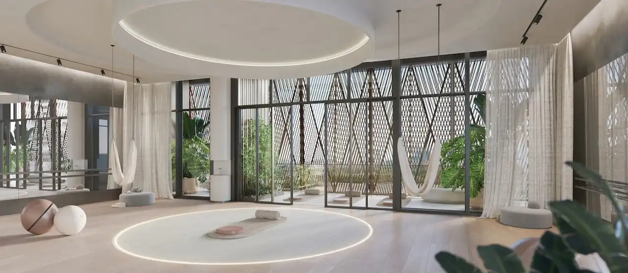 Luxury dance and wellness studio at Eltiera Views featuring a spacious circular layout, soft ambient lighting, floor to ceiling windows, and serene interior design, creating a refined wellness environment in Dubai. Presented by Tohid Fetrat.