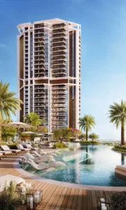 Family swimming pool at Eltiera Views with sun loungers, landscaped deck, and modern residential tower in Dubai. Presented by Tohid Fetrat.