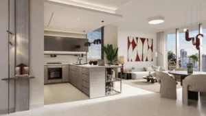 Luxury living and dining area at Eltiera Views featuring an open-plan layout, modern kitchen island, elegant furnishings, and floor-to-ceiling windows with city views, offering refined residential living in Dubai. Presented by Tohid Fetrat.