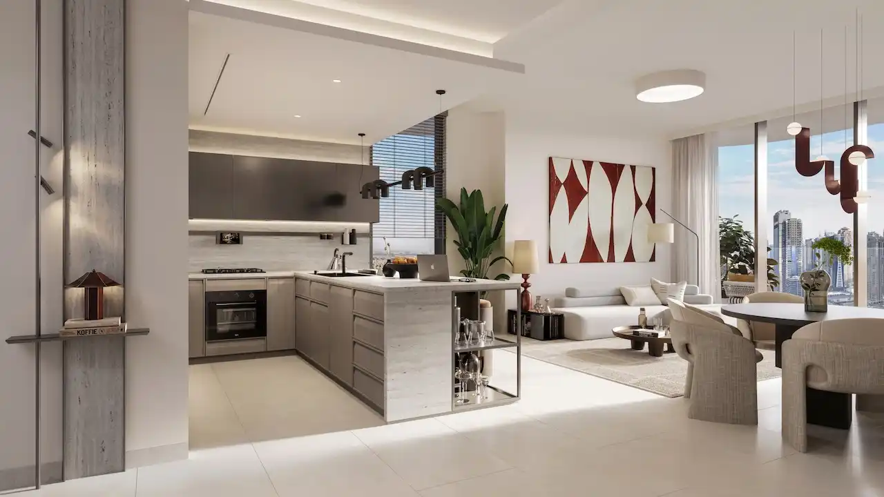 Luxury living and dining area at Eltiera Views featuring an open-plan layout, modern kitchen island, elegant furnishings, and floor-to-ceiling windows with city views, offering refined residential living in Dubai. Presented by Tohid Fetrat.