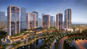 Night hero view of Eltiera Views showcasing five illuminated residential towers, landscaped podium, and waterfront setting in Dubai. Presented by Tohid Fetrat.