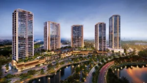 Night aerial hero view of Eltiera Views featuring illuminated residential towers, landscaped podium, and waterfront surroundings in Dubai. Presented by Tohid Fetrat.