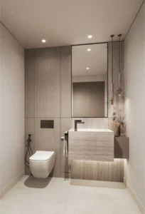 Luxury powder room at Eltiera Views featuring minimalist design, stone finishes, modern vanity, and refined lighting, offering an elegant residential bathroom experience in Dubai. Presented by Tohid Fetrat.