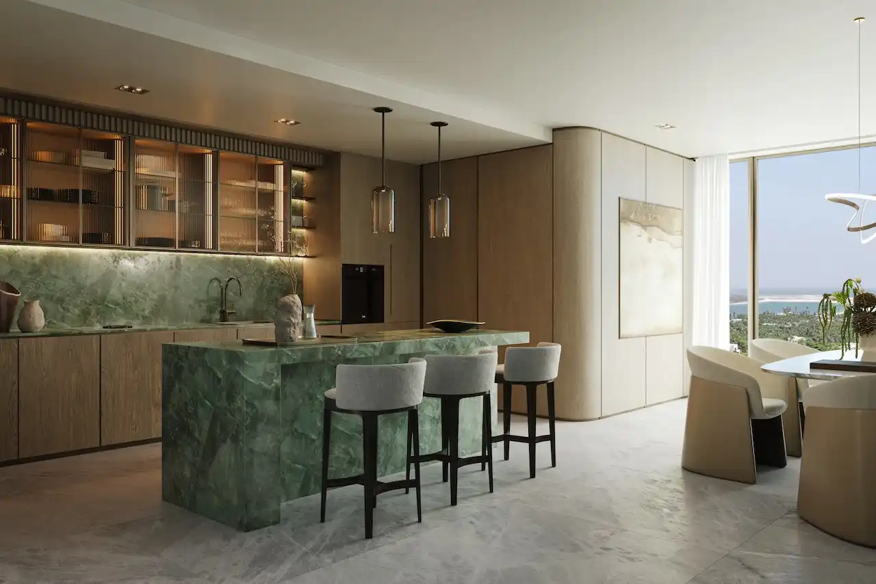 Hado luxury kitchen with green marble island full height cabinets warm lighting and panoramic community views in the SIORA community by Beyond presented by Tohid Fetrat.