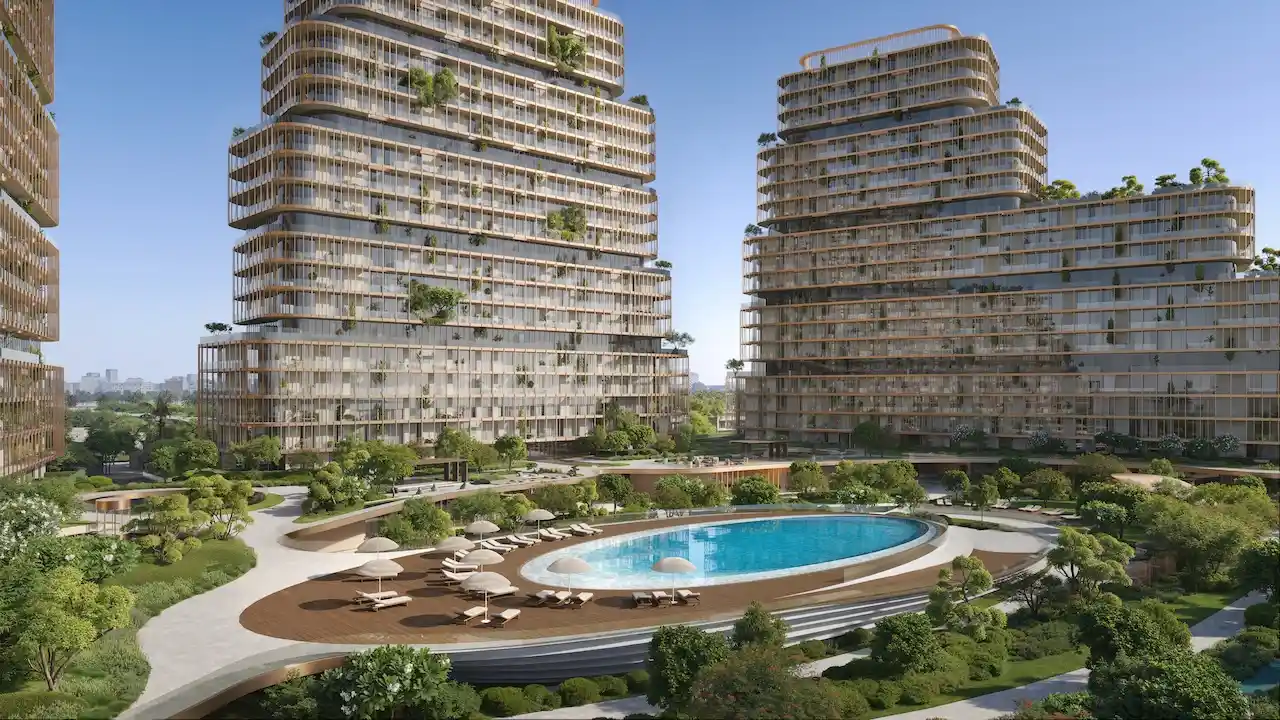 The Cove pool deck at Hado Tower in the SIORA community by Beyond featuring an oval resort style pool lush landscaping and organic architecture presented by Tohid Fetrat.