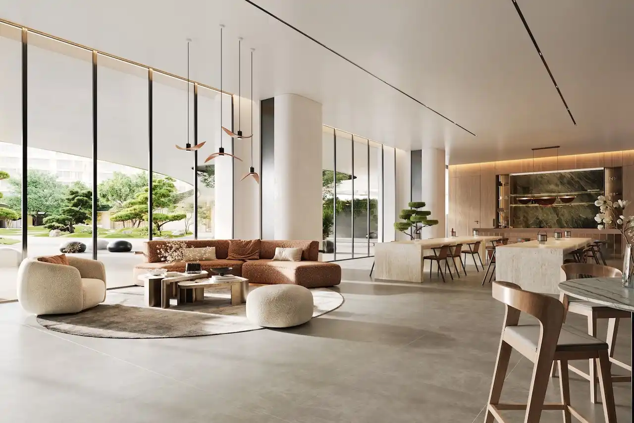 Luxury chef’s kitchen and lounge interior in Hado Tower at the SIORA community by Beyond featuring contemporary design floor to ceiling windows and landscaped garden views presented by Tohid Fetrat.