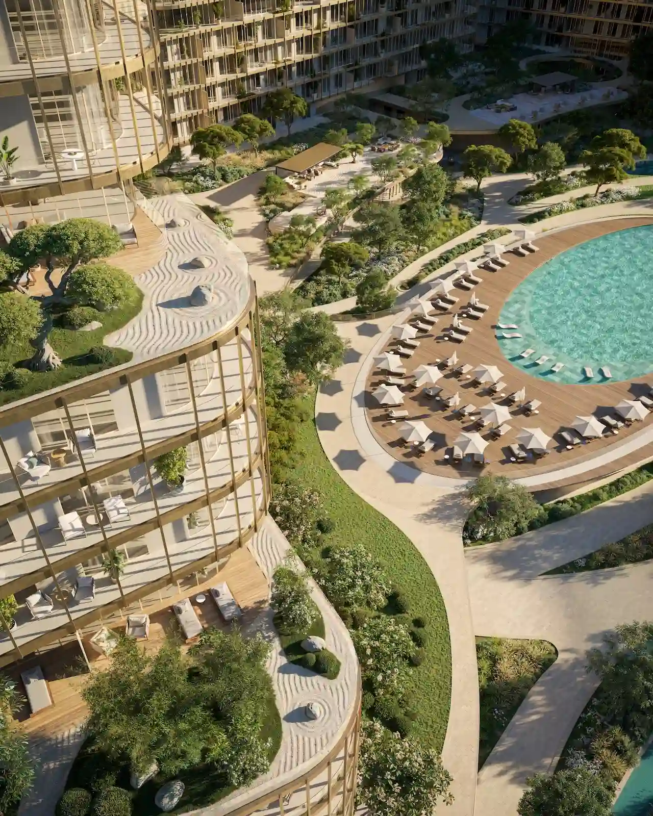 Aerial view of the outdoor terrace of Hado Tower 2 in the SIORA community by Beyond featuring landscaped gardens wooden decks and the resort style pool area presented by Tohid Fetrat.