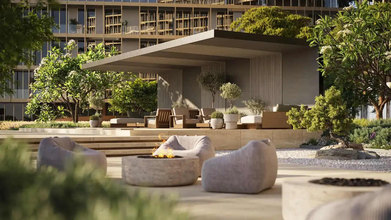 Hado Zen Lounge in the SIORA community by Beyond featuring a shaded pavilion fire pit modern outdoor seating and lush landscaping presented by Tohid Fetrat.