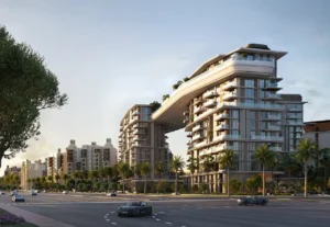 Contemporary exterior architecture of MJL Nourelle in Madinat Jumeirah Living Dubai, showcasing connected residential towers with an iconic sky bridge, palm lined boulevards and a premium urban setting. Presented by Tohid Fetrat.