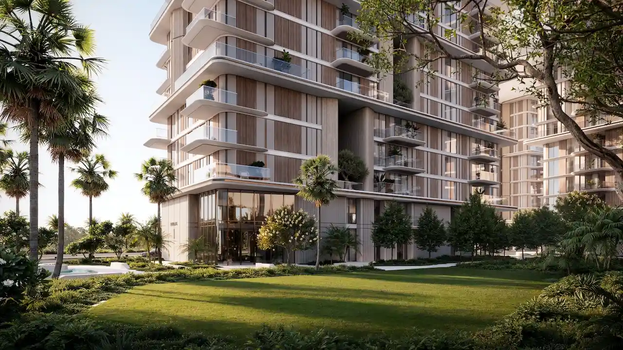 Residential garden view of MJL Nourelle in Madinat Jumeirah Living Dubai, featuring contemporary low rise architecture, private balconies, lush landscaped lawns and a calm luxury community atmosphere near the Gulf. Presented by Tohid Fetrat.