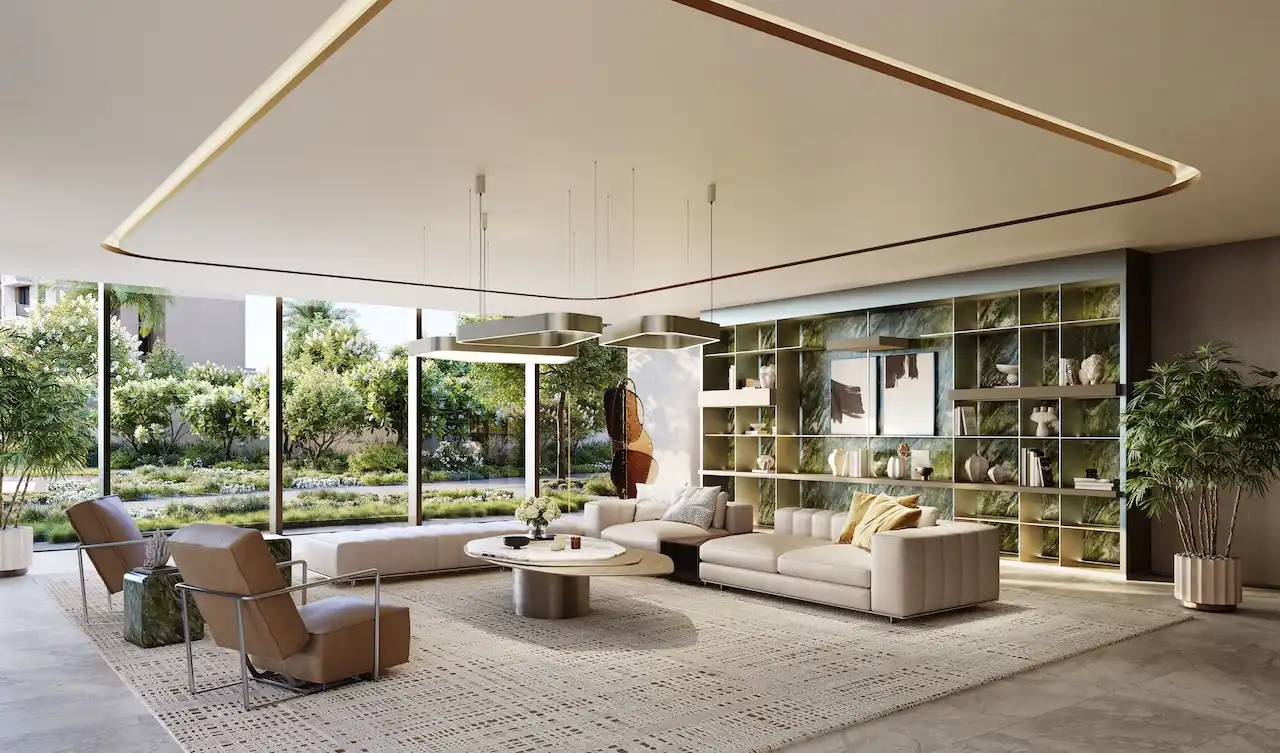 Residents lounge and lobby seating area at MJL Nourelle in Madinat Jumeirah Living Dubai, featuring elegant interior design, soft neutral tones, natural greenery views and a refined communal atmosphere. Presented by Tohid Fetrat.