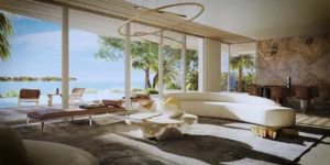 Luxury beachfront villa living room at Palm Jebel Ali featuring floor-to-ceiling glass, ocean views, contemporary design, and seamless indoor-outdoor living in Dubai on the Gulf. Presented by Tohid Fetrat.