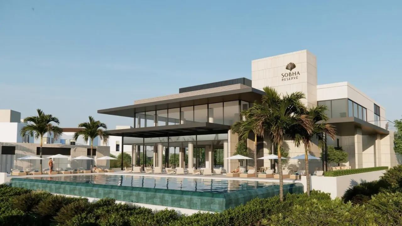 Sobha Reserve Dubai — luxury villa community with modern clubhouse, infinity pool, and palm landscaping — presented by Tohid Fetrat.