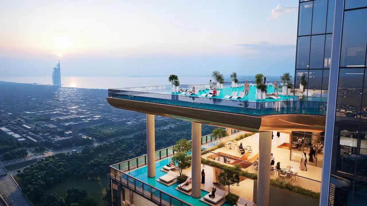Infinity pool and sky terrace at Sobha SkyParks overlooking Dubai skyline and the Gulf presented by Tohid Fetrat.