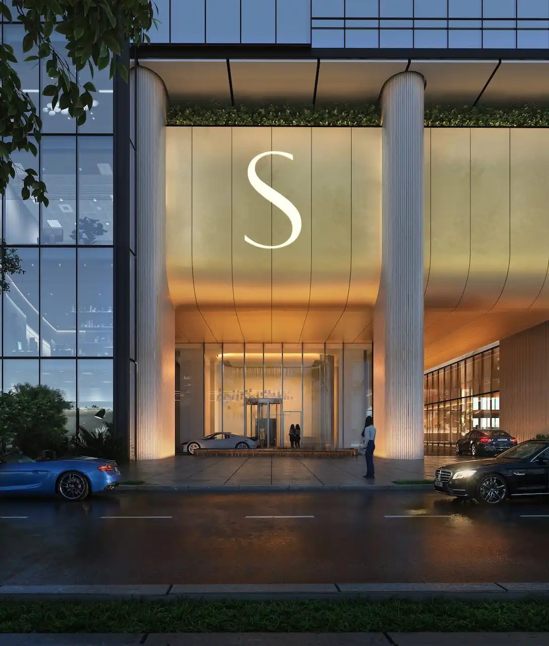 Main entrance and drop off area of Sobha SkyParks on Sheikh Zayed Road featuring a grand architectural facade and illuminated arrival experience presented by Tohid Fetrat.