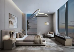 Sobha SkyParks master bedroom featuring floor to ceiling windows, modern lighting, and refined luxury interior design in Dubai prepared by Tohid Fetrat.