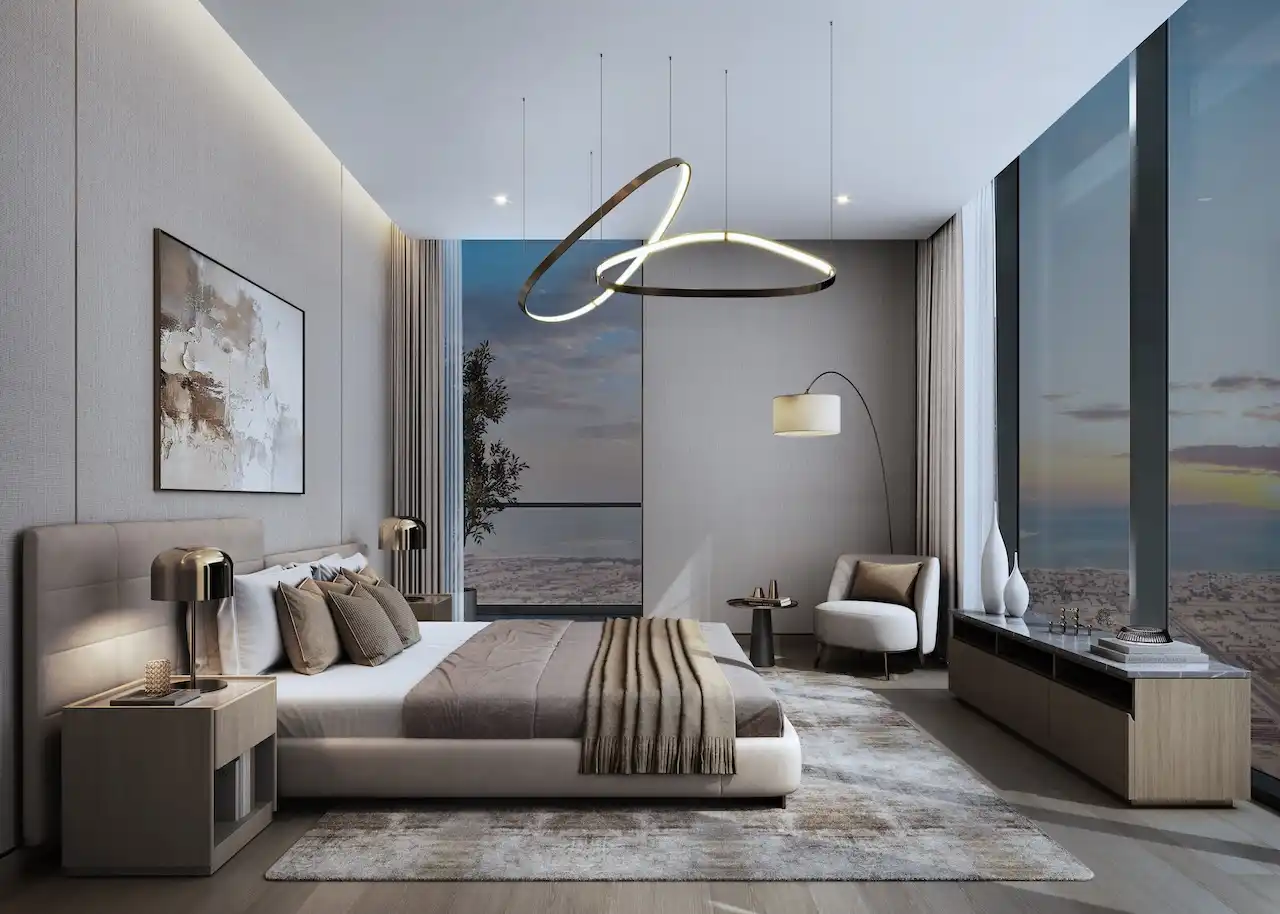 Sobha SkyParks master bedroom featuring floor to ceiling windows, modern lighting, and refined luxury interior design in Dubai prepared by Tohid Fetrat.