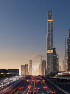 Sobha SkyParks tower rising above Sheikh Zayed Road with Dubai skyline views and illuminated terraces at dusk presented by Tohid Fetrat.
