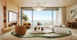 Luxury 2 bedroom apartment living room at Solaya by Meraas in Dubai, featuring contemporary interior design, floor to ceiling windows, sea views and elegant furnishings, designed for modern waterfront living. Presented by Tohid Fetrat.