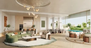 Garden living room of a 3 bedroom residence at Solaya by Meraas in Dubai, featuring open plan interiors, modern kitchen and dining area, floor to ceiling windows and direct access to a private garden. Presented by Tohid Fetrat.
