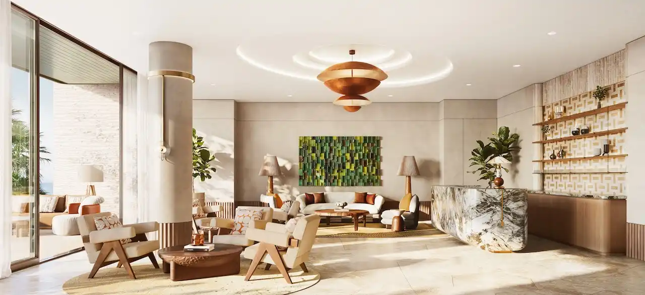Resident lounge interior at Solaya by Meraas in Dubai, featuring elegant seating areas, warm lighting, refined materials and a welcoming social atmosphere. Presented by Tohid Fetrat.