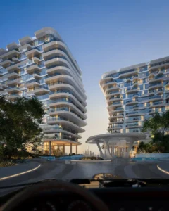 Arrival experience at Arival Piazza Passo by Beyond featuring twin contemporary residential buildings with flowing balconies, a sculptural central canopy, landscaped driveway, and a refined drop off sequence defining a premium residential entrance in Dubai. Presented by Tohid Fetrat.