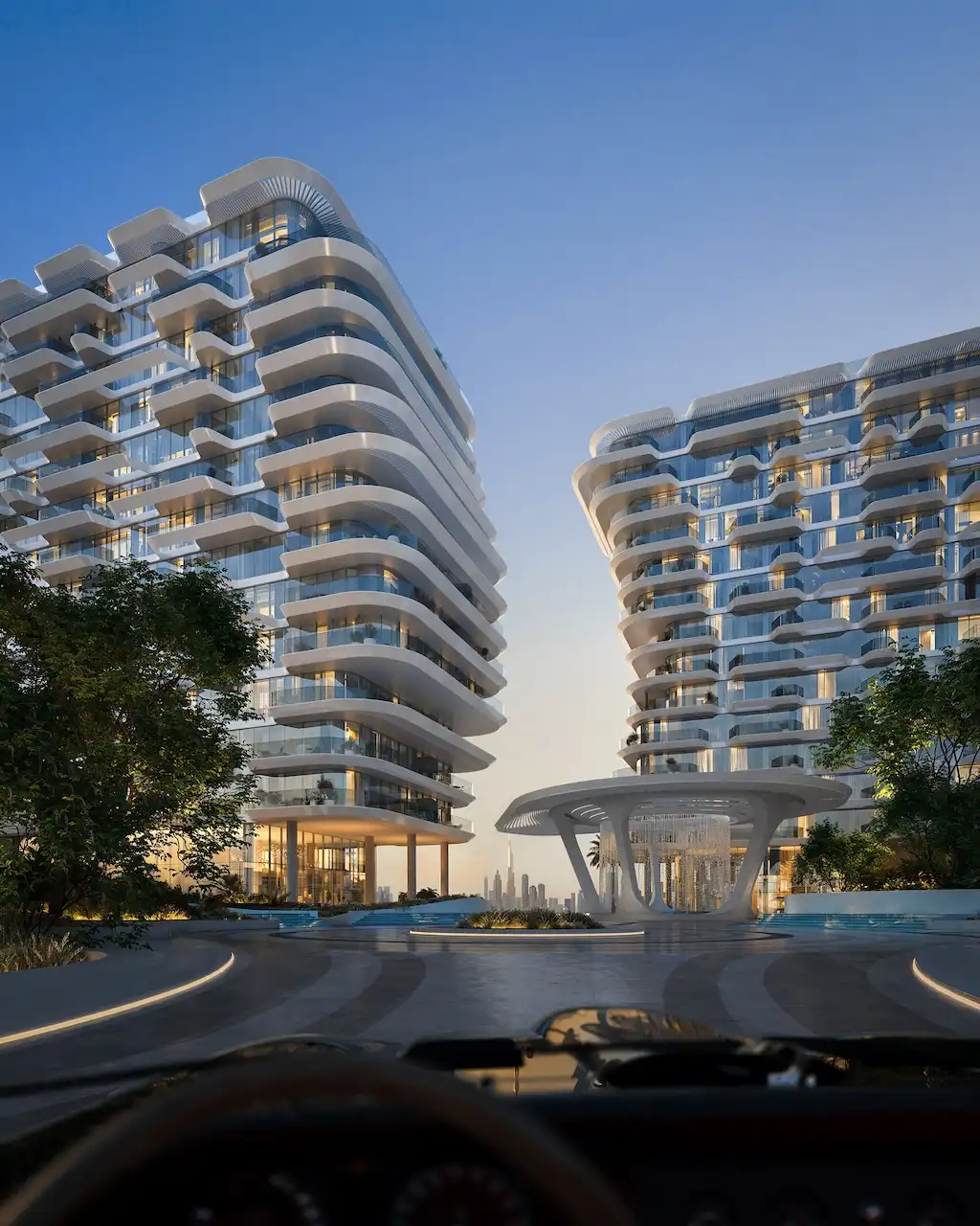 Arrival experience at Arival Piazza Passo by Beyond featuring twin contemporary residential buildings with flowing balconies, a sculptural central canopy, landscaped driveway, and a refined drop off sequence defining a premium residential entrance in Dubai. Presented by Tohid Fetrat.