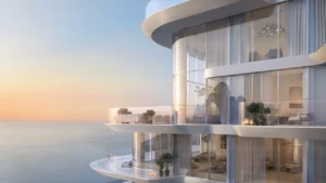 Penthouse exterior at Arival Piazza Passo by Beyond showcasing curved glass façades, expansive wraparound balconies, refined outdoor seating, and uninterrupted sea views that define elevated waterfront living. Presented by Tohid Fetrat.