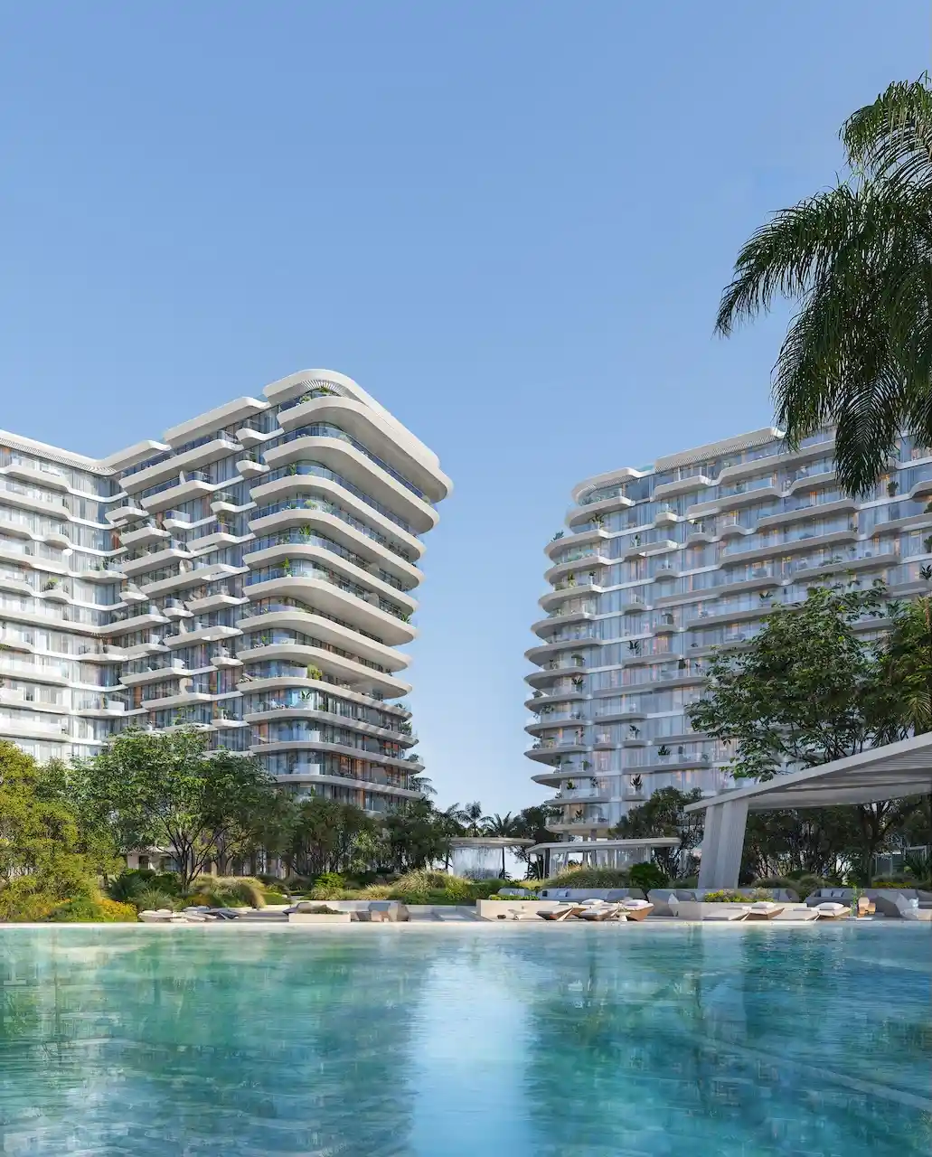 Residential swimming pool at Arival Piazza Passo by Beyond featuring calm water reflections, sun loungers, landscaped greenery, and curved modern residential towers creating a serene resort style environment. Presented by Tohid Fetrat.